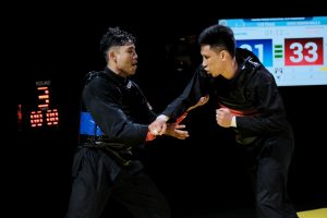 Thailand's Pornteb Pholkaew in action against Singapore's Raja Zulfadli Raja Mahmood in the Putra E category.